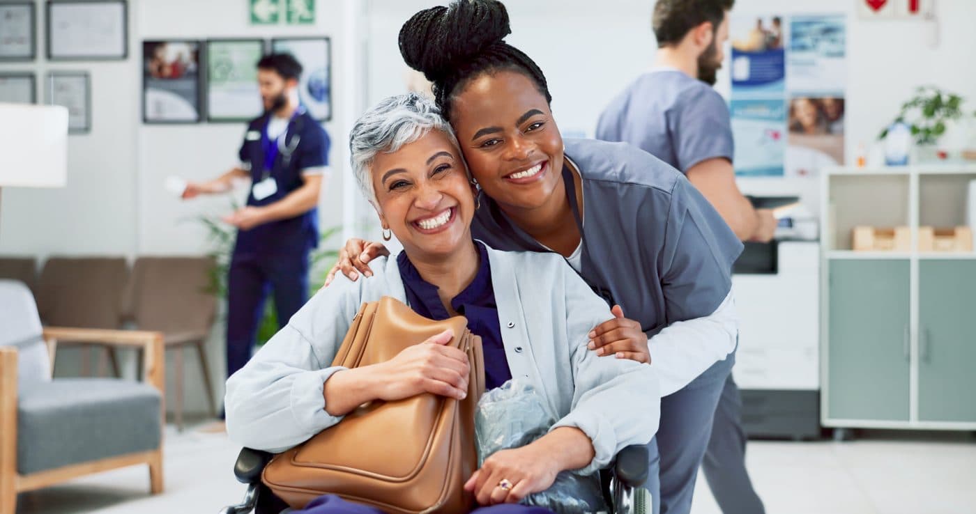 A caregiver supporting a patient at a medical office